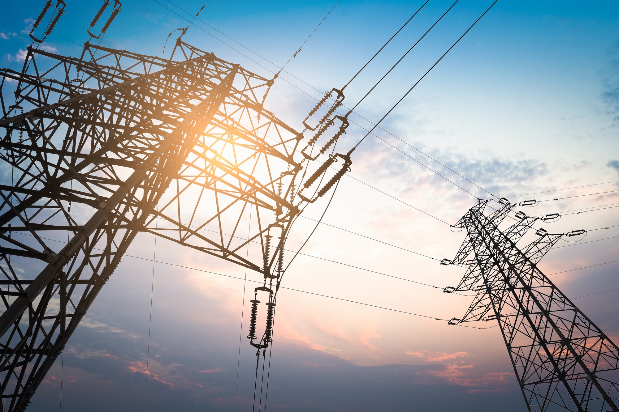 Transmission tower in sunset