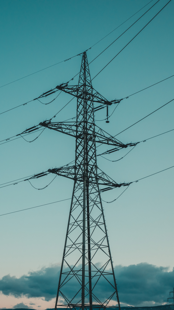 Electricity pylon against a blue sky