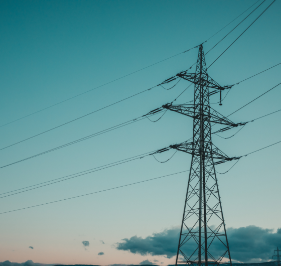 Electricity transmission line against a blue sky